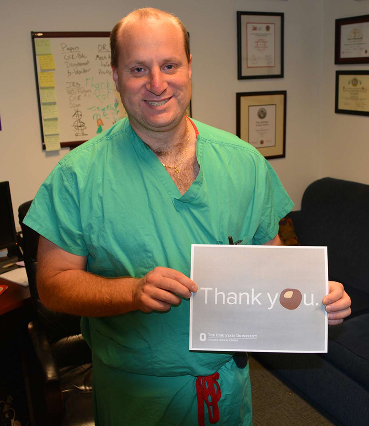 doctor holding thank you card